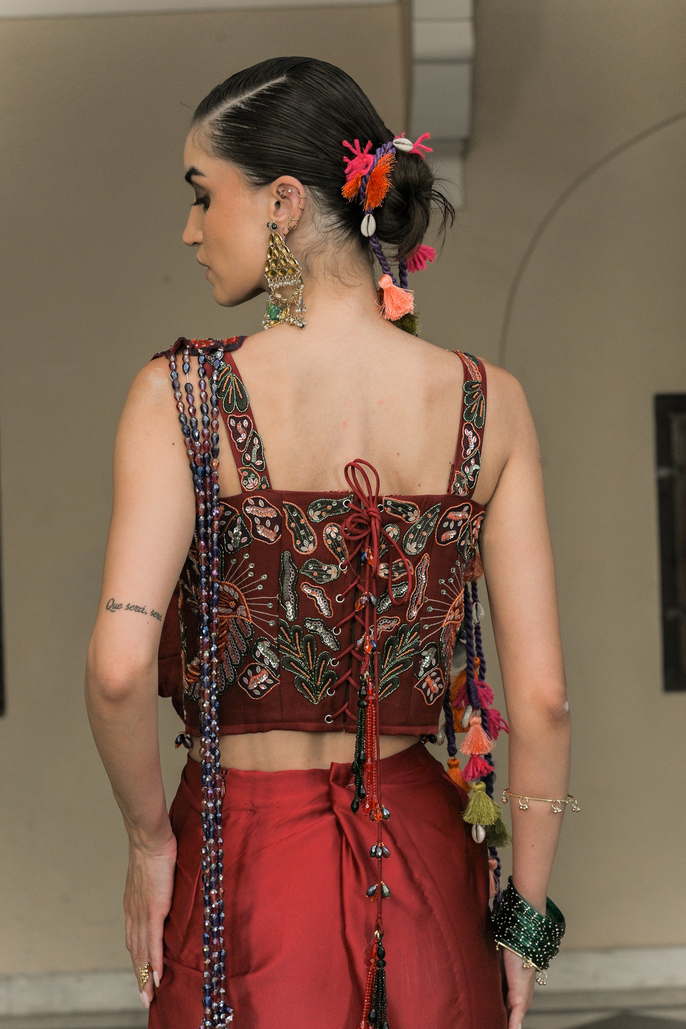 Scarlet Dhoti Skirt Flower Patch Tassel Saree Paired With Thread Work Highlight Corset Blouse