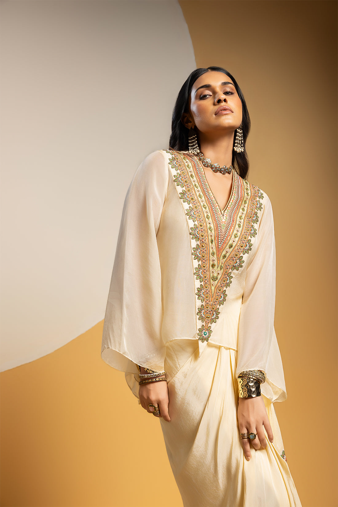 TAARANI OFF WHITE EMBELLISHED V NECK DRAPE SKIRT SET