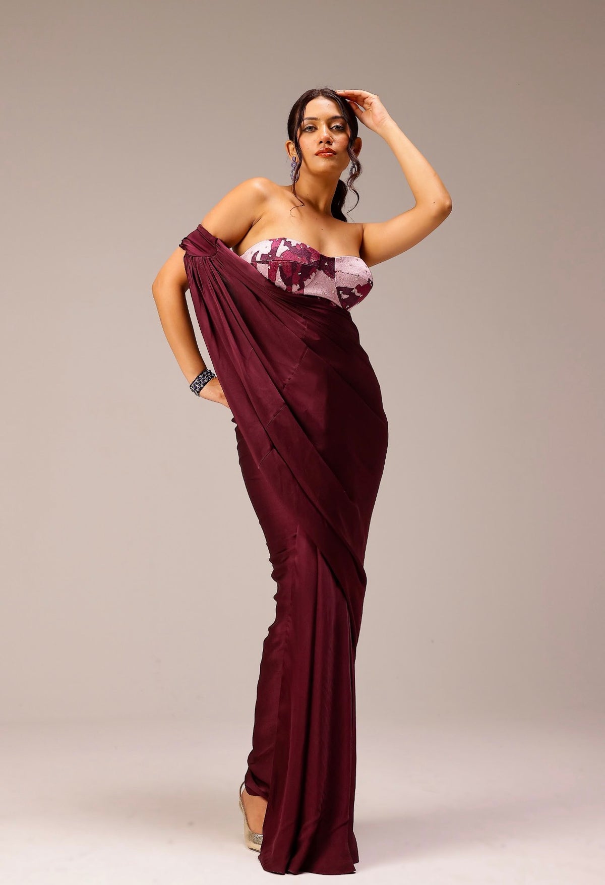 Wine Draped Saree Paired With Hand Embellished Blouse