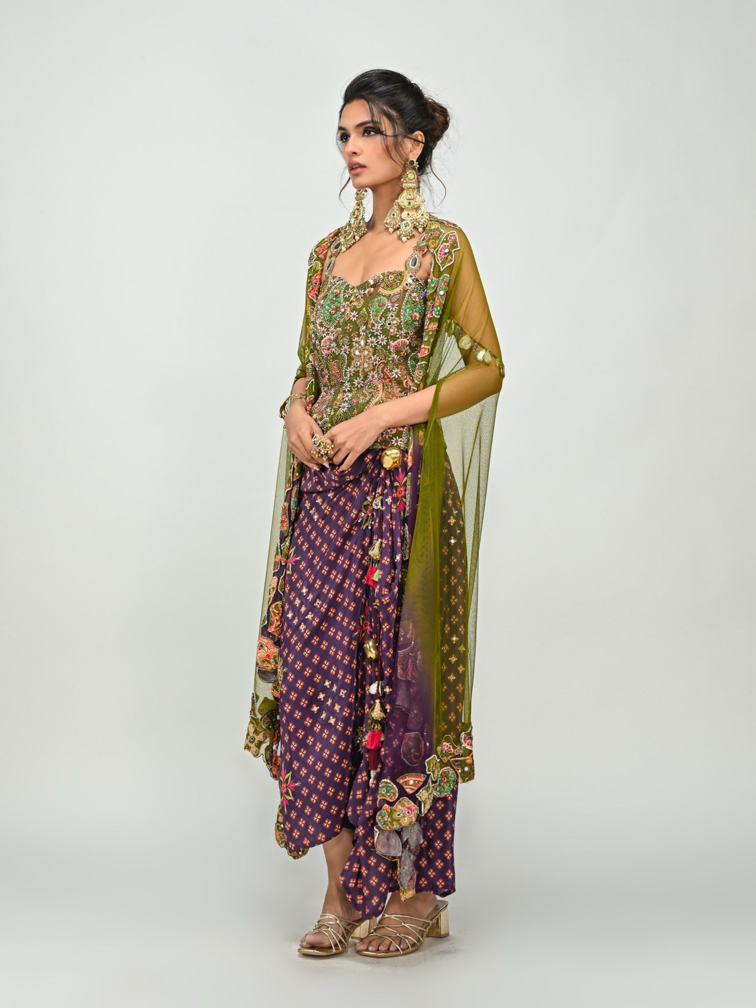 Isha Multani in Olive Badla Embroidered Corset with Plum Dhoti Skirt Set and Cape