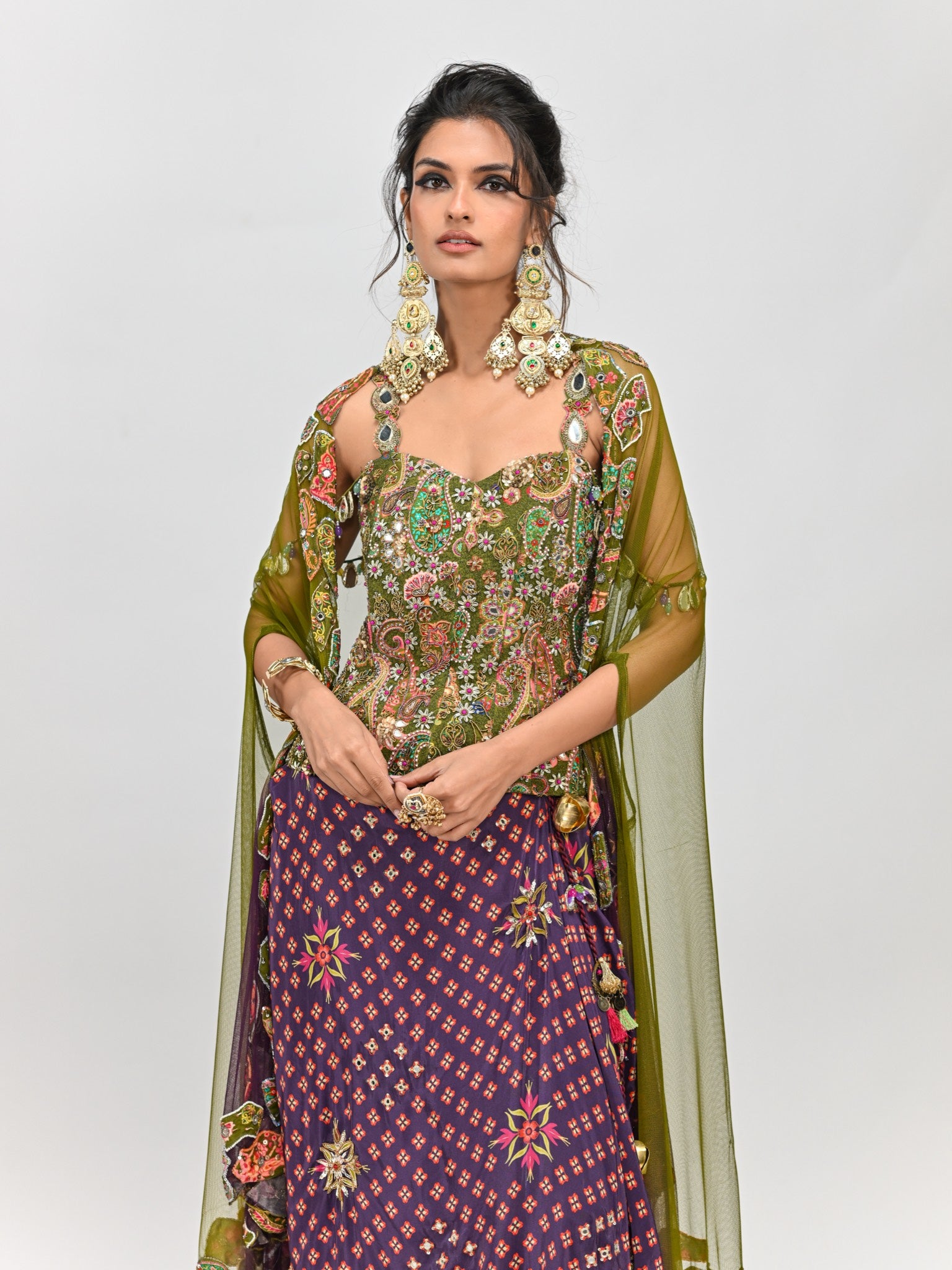 Isha Multani in Olive Badla Embroidered Corset with Plum Dhoti Skirt Set and Cape