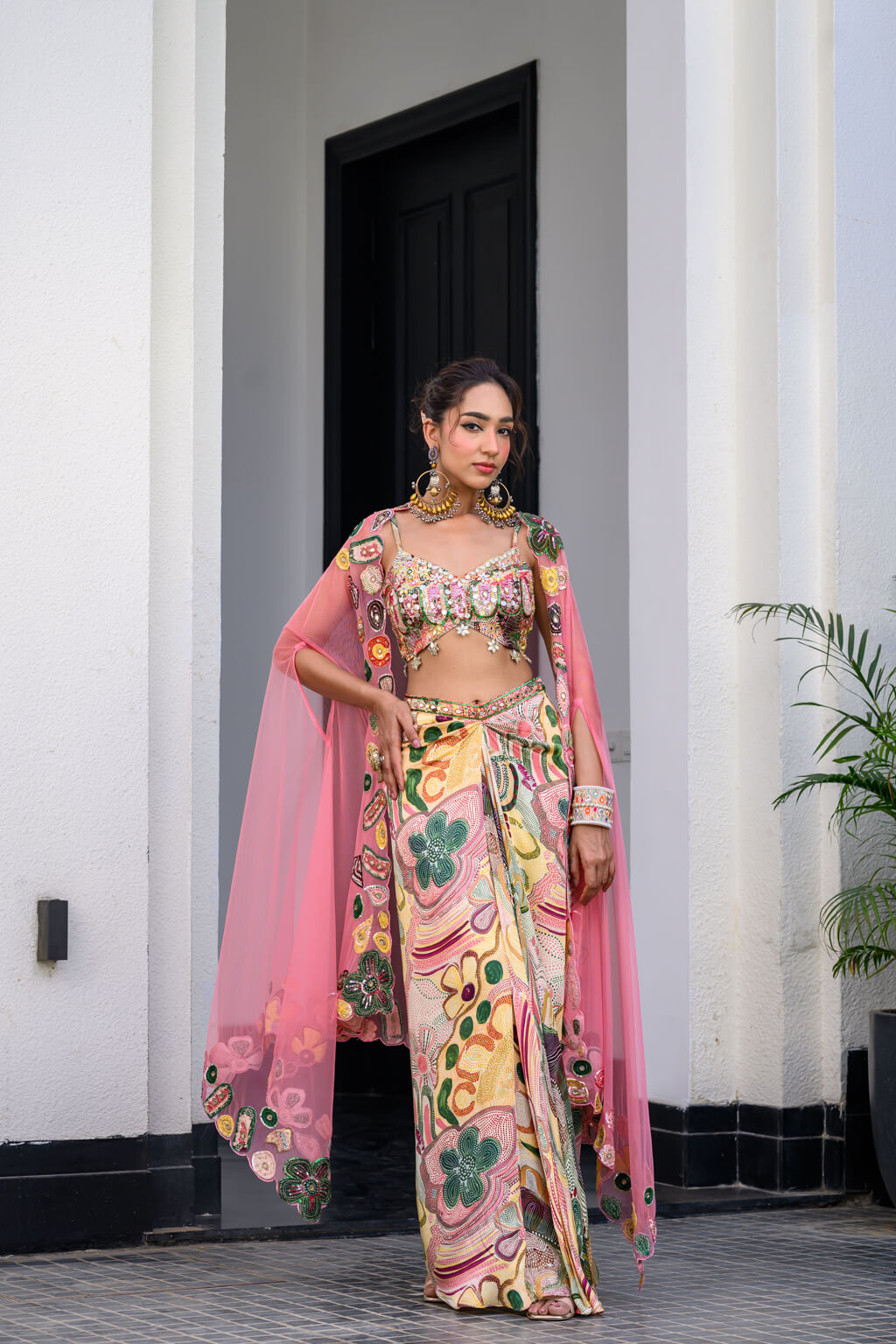 Flora highlighted Bralette Paidawn With Dhoti Skirt  Applique Cape Set