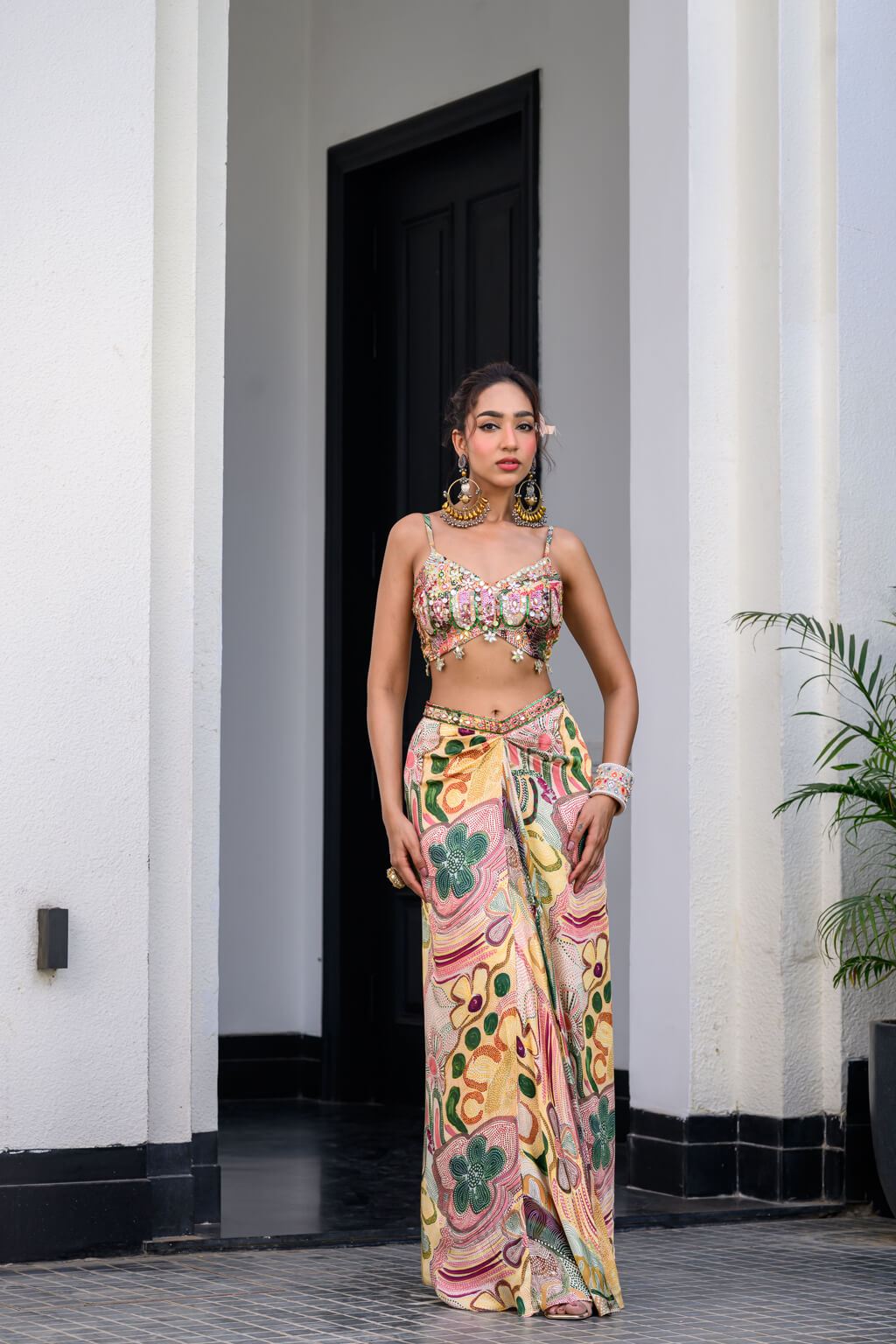 Flora highlighted Bralette Paidawn With Dhoti Skirt  Applique Cape Set