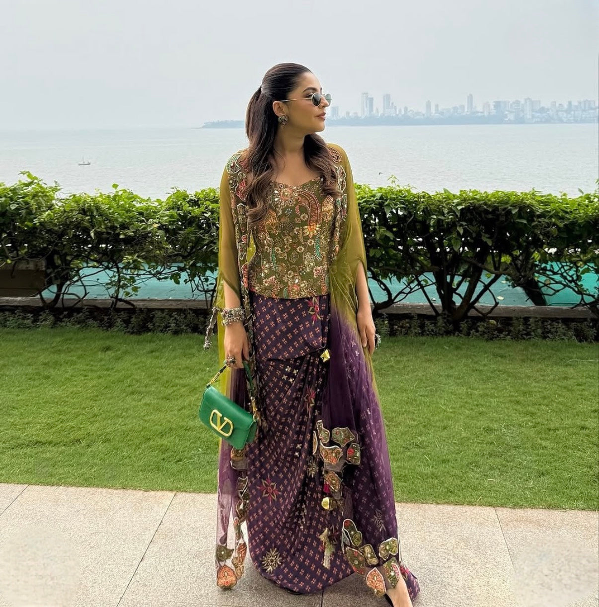Isha Multani in Olive Badla Embroidered Corset with Plum Dhoti Skirt Set and Cape